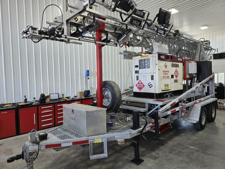 Interceptor Systems 85' Mobile Tower with Generator and Communications package being hauled on a trailer.